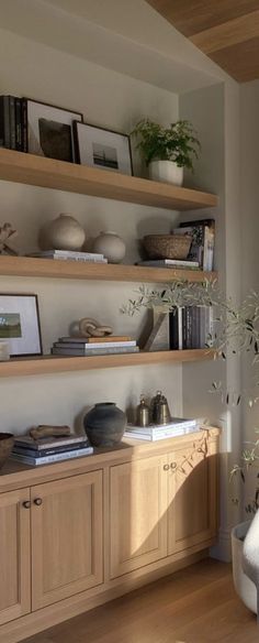 a living room filled with furniture and shelves