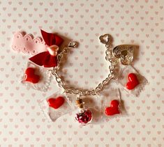 Valentine's Bracelet - Valentines Jewelry -Red Heart charms Bracelet - Girly Bracelet -Gift for Love - Love Jewelry -Heart Locket Charm Jewelry - Gift for Her Celebrate Love with this Valentine's Bracelet, featuring red heart charms, a unique heart shaped bottle filled with tiny hearts and love letters, and a heart locket charm, finished with a lovely ribbon and bow. The color silver bracelet measures 19 cm (7.5 inch) if you need a bigger or smaller size, I can adjust it for you. you will get ex Love Charm Bracelet, Cute Handmade Bracelets For Valentine's Day, Heart Charm Bracelets For Wedding On Valentine's Day, Handmade Cute Bracelets For Valentine's Day, Heart Charm Bracelets For Wedding And Valentine's Day, Heart Charm Bracelet For Wedding And Valentine's Day, Handmade Heart Bracelet For Valentine's Day, Cute Heart Beads Charm Bracelet For Valentine's Day, Cute Heart Charm Bracelet For Valentine's Day