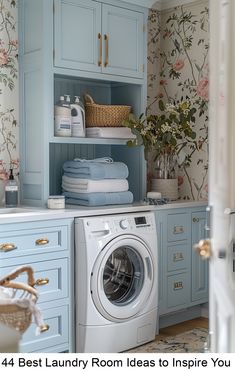 a washer and dryer in a blue laundry room with floral wallpaper on the walls