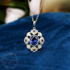 "Jewelry Details -Gold Type: Solid 10K Gold / Solid 14K Gold (Choose One in Material Option) -Center Stone: Lab Created Sapphire 7*9mm, Approximately 2.55ct Color: Blue--- 5A Clarity: VVS Cut: Oval Cut / 3EX -Side Stone: 0.16cttw moissanite Color: DEF Clarity: VVS1 Cut: Round Cut / 3EX -Pendant Width: 18.5mm -Pendant Height: 27mm The chain are not included, please contact me if you need chains. SKU: YP0044 ~*-*~Purchase Guarantee: - All our jewelry is handmade, and each process is refined. - 14 Vintage Sapphire Necklace, Wedding Sapphire Necklace Hallmarked, Hallmarked Sapphire Necklace For Wedding, Exquisite Sapphire Necklaces, Exquisite Sapphire Necklace, Sapphire Necklace For Anniversary, Luxury Tanzanite Necklace For Anniversary, Formal Sapphire Gemstone Necklace, Luxury Tanzanite Necklaces For Anniversary