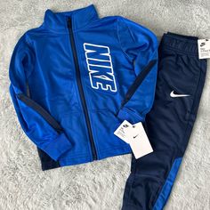 Nike Two-Piece Athletic Set For Little Boys, Size 3-4 Years. Royal Blue And Navy Blue In Color. New With Tags Attached. Nike Long Sleeve Sports Sets, Blue Winter Playwear Sets, Blue Sports Sets For Winter, Blue Sportswear Sets For Winter, Winter Sports Sets In Blue, Blue Winter Sports Sets, Blue Winter Sports Set, Fitted Blue School Sets, Blue Fitted School Sets