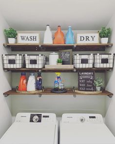 a washer and dryer sitting in a room next to each other on shelves