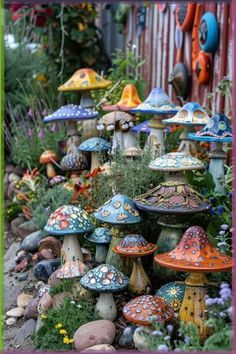 many different colored mushrooms and plants in a garden