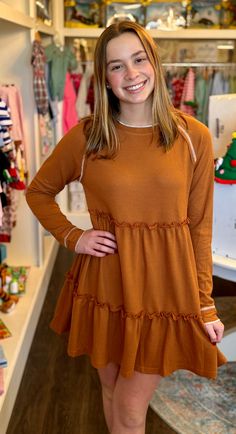 Make a style statement in this head-turning burnt orange mini dress! Featuring a tiered waffle-ruffle design, this stunning look is sure to add some fun to your wardrobe. Be ready to flaunt your flair 95% Polyester 5% Elastane Orange Mini Dress With Ruffle Hem, Fall Mini Dress With Ruffles, Fall Mini Dress With Ruffle Hem For Brunch, Trendy Fall Mini Dress With Ruffles, Fall Ruffled Mini Dress, Orange Ruffled Dress For Fall, Brown Mini Dress With Ruffle Hem For Fall, Fall Tiered Dress With Ruffle Hem, Fall Tiered Mini Dress With Ruffle Hem