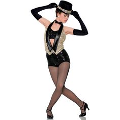 a woman in a black and gold outfit is dancing with her hands on her head