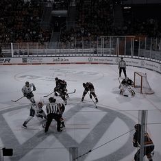 an ice hockey game is being played on the rink