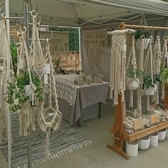 there are many macrame hanging from the ceiling