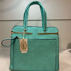 Perfect Spring Handbag In A Gorgeous Eye Catching Turquoise Color. This Bag Is A Generous 17” Tall From Handle To Base, 12.5” Long And 5” Wide. It Has Two Loop Handles As Well As The Detachable Over The Shoulder Handle. For Compartments, This Bag Has Them In Spades! Front And Back Zipper Compartments, Top Zipper, Middle Zip Compartment, Inside Small Zip Pocket And One Open Pocket. Please Note: There Is Some Mottling In The Leather Color On The Back That Was There When I Purchased This Bag. There Trendy Turquoise Tote Bag, Light Blue Rectangular Office Shoulder Bag, Turquoise Crossbody Bag With Detachable Strap, Blue Office Bag With Zipper Closure, Trendy Turquoise Rectangular Shoulder Bag, Trendy Rectangular Turquoise Shoulder Bag, Trendy Turquoise Shoulder Bag For Daily Use, Trendy Turquoise Shoulder Bag, Turquoise Bags With Zipper Closure For Everyday Use