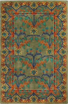 a green rug with blue, orange and red designs on the bottom half of it