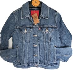 A Trucker Jacket makes an outfit. You’d be hard-pressed to find a jacket with an easier shape, more versatile weight or inherent sense of cool. Made with an extra-relaxed silhouette and an elongated hem for an oversized take on the classic denim jacket. Meant to be worn forever, wherever, whenever.  Sizing: Women's SMALL Material: 86% Cotton, 13% Polyester, 1% Elastane Garment Style: Long Sleeve, Front Button Cuff Type: Barrel Cuff Pockets: Side Slit Pocket, Chest Buttoned Flap Pocket Garment St Levi Jean Jacket, Demin Jacket, Sherpa Lined Jacket, Black Jean Jacket, Tie Dye Jeans, Denim Trucker Jacket, Classic Denim Jacket, Jean Jacket Women, Lined Jeans