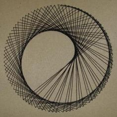 a circular wire sculpture sitting on top of a table