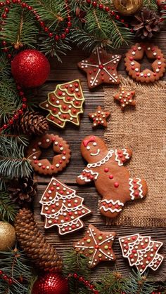 christmas cookies and decorations on a wooden table