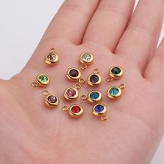 Welcome to our newly opened shop! We handpick top quality with affordable price from all around the world and now present you the these little sparkle things! * This listing is for 1 piece of the birthstone charm shown in the picture* Perfect for making your own earrings, necklace, choker, bangles. Material : Stainless Steel, 14k gold plate, Rose gold plate, Crystal Size: 6.5 mm x 9.5mm Shipping: ship within 2 business day via USPS fist class parcel. Usually takes 3-5 business day to deliver. An Birthstone Dangle Charms Gift, Dangle Birthstone Charms As Gift, Gold Birthstone Necklace With Charms For May, Rose Gold May Birthstone Necklace, Gold Dangle Charm Necklace With Birthstone, Rose Gold Birthstone Charm Necklace For Birthday, Gold Round Birthstone Necklace With Charms, Nickel-free Gold Birthstone Necklace For May, May Birthstone Round Charms Necklace