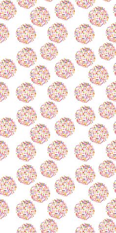 an abstract pattern made up of circles on white paper with multicolored dots in the middle