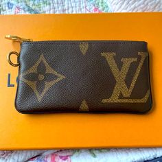 Louis Vuitton Rectangular Pouch From The Trio Pouch, Giant Monogram Print, Dimensions Are L 19.5 X H 10 Cm, Never Used In Brand New Condition, Sticker Still On Zipper, Gold Hardware, Small Gold Circle Piece Can Be Removed. Louis Vuitton Coin Purse, Louis Vuitton Sarah Wallet, Brown Clutch, Bags Louis Vuitton, Louis Vuitton Wallet, Gold Circle, Lv Monogram, Monogram Prints, Black Wallet