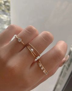 Simple stacker ring with a lot of sparkles! Made in 14k gold fill and is tarnish-resistant, showerproof, and safe for sensitive skin. Just keep it away from chemicals such as hand sanitizer, soap, and lotion for a longer life span. …………………………………. D E T A I L S • Available from US 5 to 10• Band measures 1mm• Keep away from chemicals such as lotion, soap, and hand sanitizer• Tarnish-resistant, waterproof, and safe for sensitive skin • 100% 14K Gold Filled • Build your ring stack and save up to 15% Cute Rings Aesthetic Simple, Mum Diy, Pearl Stacking Ring, Dainty Gold Jewelry, Dainty Rings, Stacker Rings, Gold Rings Simple, Dainty Gold Rings, S Jewelry