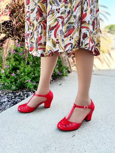 Retro Fitted Low Heel Shoes, Retro Fitted Low Heel, Fitted Retro Low Heel, Retro High Heels With Penny Strap, Retro High Heel Penny Strap Heels, Retro Penny Strap High Heels, Retro Spring Heels With Red Sole, Vintage Red Round Toe Heels, Retro Red Block Heel Shoes