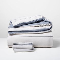 folded sheets and pillows on top of each other