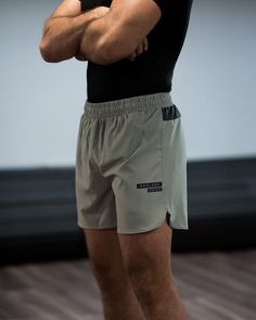 Casual Athletic Fit Squat Proof Shorts, Summer Training Bottoms With Built-in Shorts, Gray Athletic Fit Training Shorts, Gray Athletic Fit Shorts For Training, Gray Training Shorts For Summer, Gray Training Bottoms For Summer, Casual Squat Proof Running Bottoms, Casual Squat Proof Sports Shorts, Functional Athletic Shorts With Built-in Liner