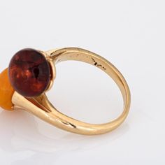 Finely detailed vintage amber ''toi et moi'' ring crafted in 14k yellow gold.   Two pieces of amber measure 9mm each. Note: slight chip to the yellow amber (visible under a 10x loupe).   The two stone design or "Toi et Moi" is a French term for "You and Me". A lovely sentiment in jewellery. The medium profile ring (8.5mm - 0.33 inches) sits comfortably on the finger. Ideal worn as an alternative engagement ring or a right hand ring for everyday wear.    The ring is in good condition and was rece Heirloom 14k Gold Amber Rings, Heirloom Amber Ring In 14k Gold, Classic Amber 14k Gold Rings, Classic 14k Gold Amber Ring, Classic Amber Ring In 14k Gold, Heirloom Amber Ring, Heirloom Amber Round Rings, Right Hand Ring, Alternative Engagement Ring