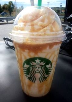 a starbucks drink sitting on top of a table