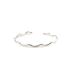 This sterling silver cuff is perfect as a stand-alone piece or as an addition to your stack. The scalloped design is crafted by hand and due to the soft nature of silver, it is easily stretched or squeezed to create the perfect custom fit for your wrist. Solid sterling silver. Bracelet width is approximately 2.05mm. Please advise the sizing chart to select your cuff size. Need a customized bracelet size? Contact hello@lilywujek.com. Adjustable Wavy Stackable Jewelry, Adjustable Stackable Wavy Jewelry, Adjustable Wavy Sterling Silver Jewelry, Elegant Adjustable Wavy Bracelets, Elegant Adjustable Wavy Bangle, Scalloped Design, Metal Words, Sterling Silver Cuff, Sterling Silver Bracelet