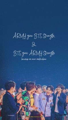 two men standing next to each other in front of a crowd with the words army give bits strength and bts give army strength