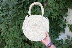 Lightweight Bag. Large Bag. Hand died palm leaf. Round Handel. Beach Bag. TASSEL SOLD SEPARATELY Diameter- 10 inches Height including handals- 15 inches Bohemian Straw Bag For Vacation, Bohemian Spring Handwoven Straw Bag, Spring Bohemian Handwoven Straw Bag, Bohemian Straw Bag With Braided Handles For Festival, Bohemian Natural Straw Bag For Spring, Natural Bohemian Straw Bag For Spring, Handmade Summer Straw Bag For Festival, Handwoven Bohemian Bags For Spring, Bohemian Fair Trade Straw Bag For Beach