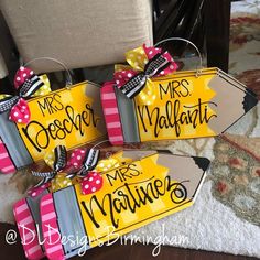 three yellow and pink gift bags with bows on the handles that say mr and mrs