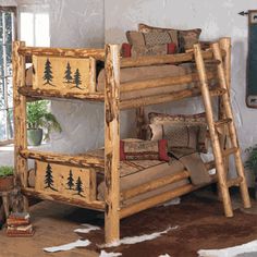 a wooden bunk bed sitting on top of a brown cowhide rug in a bedroom