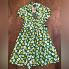 Brand New, Tags Attached Modcloth Dress. Floral Pattern. Yellow, Green And White Coloring. Beautiful Piece! Vintage Green Dress For Day Out, Green Floral Print Sundress With Short Sleeves, Yellow Retro Dress For Vacation, Retro Yellow Dress For Vacation, Yellow Short Sleeve Dress For Daytime, Retro Green Dress For Brunch, Retro Yellow Dresses For Vacation, Fitted Yellow Sundress For Casual Wear, Fitted Yellow Sundress For Casual Occasions