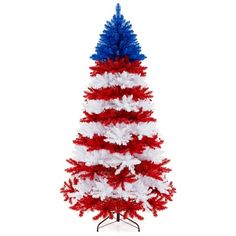 a red, white and blue christmas tree on a black stand against a white background