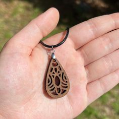 Details: - Wooden Pendant Necklace - Laser Engraved Wood Pendant  - 1.25 inches pendant length, adjustable chain All jewelry is handmade and unique to each order! Handmade Adjustable Teardrop Drop Necklace, Handmade Adjustable Teardrop Pendant Necklace, Laser Cut Teardrop Jewelry As A Gift, Bohemian Teardrop Pendant Drop Necklace Gift, Brown Teardrop Necklace For Gift, Brown Teardrop Necklace For Gifts, Handmade Spiritual Drop Necklace As Gift, Brown Teardrop Jewelry For Gift, Handmade Adjustable Drop Necklace As Gift