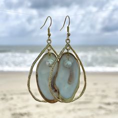 Unique oyster shell gold teardrop hoop earrings with round pearl. Small oyster is gold backed with gold outline on front. Hoop size is 2 inches in length by 1 1/4 in width which does not include the drop length. These earrings are light weight and can be dressed up or worn casual. Oyster shells are found in coastal Georgia. Each oyster is unique in color, shape and size. I will be happy to send a picture of the exact earrings before you purchase them. I also create custom orders. Oyster Jewelry, Coastal Georgia, Teardrop Hoop Earrings, Oyster Shells, Savannah Ga, Oyster Shell, Jewelry Earrings Hoops, Teardrop Earrings, Savannah