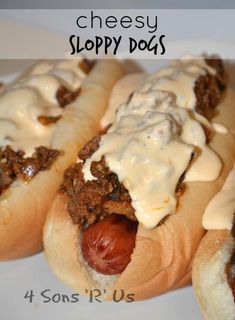 three hot dogs covered in cheese and toppings on a white plate with the words cheesy sloppy dogs