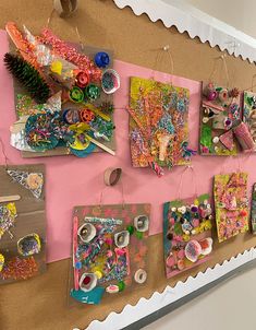 a bulletin board covered in lots of crafting supplies and paper machs hanging from it's sides