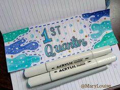 two markers are sitting on top of a notepad with the words 1st quarter written in it