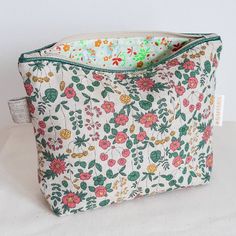 Beautiful makeup bag sewn with liberty of london fabric. Perfect for storing makeup brush and accessories, skincare products or medicine. Medium size, this practical case is the perfect accessory to keep your daily essentials close at hand. Beautiful unbleached cotton canvas fabric with floral pattern, liberty fabric interior. A perfect gift for a mom, a priceless colleague, a friend for her 20th birthday... This liberty zipped pouch can also be offered to a bridesmaid  as a thanks gift. Offer t Cloth Makeup Bag, Quilted Make Up Bag, Storing Makeup Brushes, Liberty Of London Fabric, Fabric Tote, Zip Pouch, Liberty Fabric, Quilted Bag, Beautiful Makeup