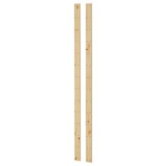 a pair of wooden rulers on a white background