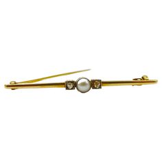 This brooch is a true work of art, crafted with skill and precision to create a timeless piece that will be treasured for generations to come. Crafted from 14k yellow gold, this bar brooch is finely worked and features a safety clasp that ensures it stays securely in place at all times. At the center of the brooch is a lustrous pearl, its natural beauty accentuated by the delicate gold setting. Flanking the pearl are two old European cut diamonds, their unique and intricate faceting adding a tou Bar Brooch, European Cut Diamonds, Gold Bar, Rose Cut Diamond, Gold Set, Belleza Natural, Classic Elegance, Vintage Charms, Rose Cut