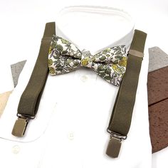 Delivery Policy & Shipping ORDERS SHIPPED VIA EXPRESS ARE TYPICALLY SHIPPED WITHIN 4-7 DAY AND ARRIVE IN 2-4 BUSINESS DAYS Olive Green Suspenders, Floral Bowtie, Wedding groom suspender, Groomsmen suspenders, Ring bearer outfit, Pale Orange Bowtie, Groomsmen Gift Suspender size : ■ BABY SET (6 - 18 mo): ■ BOW TIE - 3.3" inches (8.5 cm )  Pre-tied and made with adjustable white strap and white plastic clasp. ■ SUSPENDERS - adjustable from 16" to 27". Made of elastic. / Y-shape back. ■ Y-back susp Dapper Suspenders For Wedding, Groom's Bow Tie With Suspenders, Dapper Wedding Suspenders, Suspenders Ring Bearer, Bowtie Groomsmen, Floral Bowtie, Groom Suspenders, Bowtie Wedding, Green Suspenders