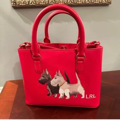 Stylish Handbag/Satchel With Two Embroidered Scottish Terriers At The Center Front. Embroidered With "Lrl" Monogram Branding At The Corner Of It. Interior: Center Zip Pocket, Small Zip Pocket On Side, Open Pocket Comes With Dust Bag Approx. 10.5'' L X 7.75 "H 4.75" D Designer Red Embroidered Bag, Ralph Lauren Holiday, Navy Purse, Ralph Lauren Handbags, Scottish Terriers, Patent Leather Bag, Ralph Lauren Bags, Black Satchel, Ralph Lauren Leather