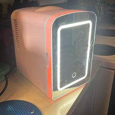 an old computer that has been turned into a light up case for it's display