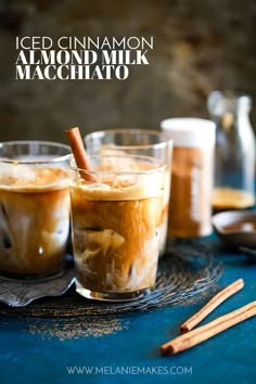 iced cinnamon almond milk machchato in glasses with cinnamon sticks