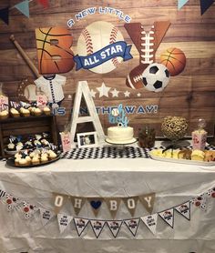 an all star sports themed birthday party with cupcakes and desserts on the table