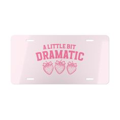 a license plate that says,'little bit dramatic'with three strawberries on it