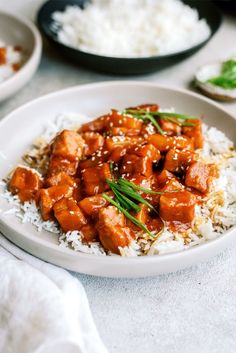 a white plate topped with chicken and rice