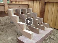 a set of stairs made out of wooden planks