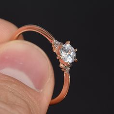 "Rose gold ring, Women engagement ring, Rose gold engagement ring, Promise ring, Minimalist ring, Small ring, Tiny ring, Delicate ring WE OFFER UNLIMITED PERIOD INSTALLMENTS PLAN This is a beautiful, stunning, feminine ring that works well for all occasions, styles, and ages. You will love it! Ring information: Main stone: White cubic zirconia Approximate size: 5mm Accent stones: Cubic zirconia Metal type: Gold Metal stamp: 14k Gold Customization / Replacements It's easy to create jewelry that's Rose Gold Diamond Midi Rings As Gift, Gift Rose Gold Diamond Midi Rings, Elegant Promise Diamond Ring With Simple Design, Classic Rose Gold Diamond Midi Rings, Rose Gold Open Couple Rings For Promise, Rose Gold Promise Couple Rings With Open Design, Promise Rose Gold Couple Rings With Open Design, Dainty Rose Gold Crystal Anniversary Ring, Elegant Simple Design Rose Gold Diamond Ring