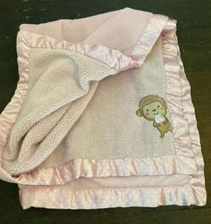 a pink blanket with a monkey on it